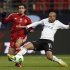Emerson of Brazil's Corinthians fights for the ball against Rabia of Egypt's Al-Ahly during their Club World Cup semi-final soccer match in Toyota