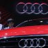 Visitors look at an Audi A3 on media day at the Paris Mondial de l'Automobile