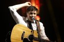 Marcus Mumford, lead singer of Mumford & Sons, performs on the Pyramid Stage at the Glastonbury music festival at Worthy Farm in Somerset