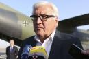 Germany's Foreign Minister Frank-Walter Steinmeier speaks to the media upon his arrival to Baghdad International Airport
