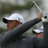 Tiger Woods of the U.S. watches his tee shot during a practice round ahead of the British Open golf championship at Royal Lytham and St Annes