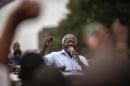 RENAMO presidential candidate Afonso Dhlakama addresses a cheering crowd of supporters during a campaign rally on October 11, 2014 in Maputo, Mozambique