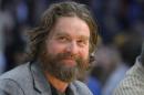 FILE - In this Feb. 28, 2013 file photo, actor Zach Galifianakis watches the Los Angeles Lakers play the Minnesota Timberwolves in their NBA basketball game in Los Angeles. President Barack Obama is hamming it up online to promote his health care plan. Obama joked Tuesday with Galifianakis, including poking fun at the poorly reviewed "Hangover Part III" during an interview on thhe website Funny or Die. (AP Photo/Mark J. Terrill, File)