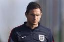 England footballer Frank Lampard arrives for a training session at Arsenal's training ground, London Colney, north of London, on November 13, 2013