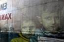 Syrian children seen in a bus after arriving at the port of Piraeus,
