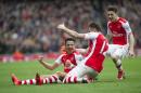 Arsenal's Alexis Sanchez, left, celebrate with teammates Olivier Giroud, center, and Hector Bellerin after scoring against Liverpool during their English Premier League soccer match, at Emirates Stadium, in London, Saturday, April 4, 2015. (AP Photo/Bogdan Maran)