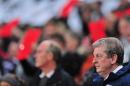 England manager Roy Hodgson (Below R) looks on during an international friendly football match between England and Germany at Wembley Stadium in north London, on November 19, 2013