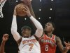 Milwaukee Bucks' Larry Sanders (8) defends against New York Knicks' Carmelo Anthony (7) during the first half of an NBA basketball game on Friday, April 5, 2013, in New York. (AP Photo/Frank Franklin II)