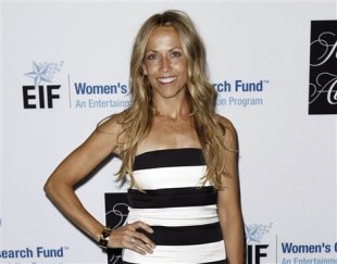 Can you really be OK if you have a brain tumor? Sheryl Crow tells fans she's fine. (Photo: Matt Sayles/AP)