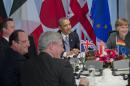 President Barack Obama participates in a G7 Leaders meeting at Catshuis, the official residence of the Dutch Prime Minister, in The Hague, Netherlands, Monday, March 24, 2014. Seated clockwise from Obama are, German Chancellor Angela Merkel, Canadian Prime Minister Stephen Harper, French President Francois Hollande, and British Prime Minister David Cameron. (AP Photo/Pablo Martinez Monsivais)