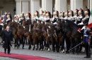 Italy's newly re-elected president Napolitano inspects a guard of honor during a welcoming ceremony at the Quirinale palace in Rome