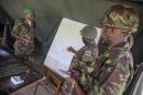 Handout photo shows AMISOM Sector Two Commander and head of the Kenyan contingent Brigadier Ngere speaking with senior officers at their sector headquarters in Dhobley