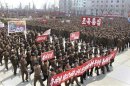 North Koreans attend a rally held to gather their willingness for a victory in a possible war against the United States and South Korea in Nampo