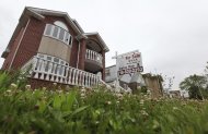 A "for sale" sign is seen outside a home in New York June 19, 2012. REUTERS/Shannon Stapleton