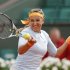 Azarenka of Belarus hits a return to Vesnina of Russia during their women's singles match at the French Open tennis tournament in Paris