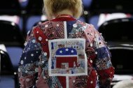 A delegate wearing a quilt shirt walks to her seat before the second session of the Republican National Convention in Tampa, Florida, August 28, 2012 REUTERS/Mike Segar
