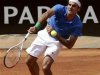 Federer of Switzerland serves the ball to Berlocq of Argentina during their men's singles match at the Rome Masters tennis tournament