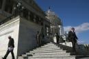 Members walk down the steps of the House side of the US Capitol on November 14, 2014 in Washington, DC