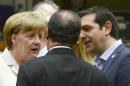 German Chancellor Angela Merkel, left, speaks with French President Francois Hollande, center, and Greek Prime Minister Alexis Tsipras during a meeting of eurozone heads of state at the EU Council building in Brussels on Sunday, July 12, 2015. Skeptical European creditors raced Sunday to narrow differences both among themselves and with Athens, aiming to come up with a tentative agreement to stave off an immediate financial collapse in Greece that would reverberate across the continent. (AP Photo)