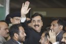 FILE - In this Thursday, April 26, 2012 file photo, Pakistani Prime Minister Yousuf Raza Gilani waves upon his arrival at the Supreme Court for a hearing in Islamabad, Pakistan. Pakistan's top court declared on Tuesday, June 19, 2012 that the country's prime minister was disqualified from office due to an earlier contempt conviction, delivering what appeared to be fatal blow against the premier's political career and ushering in political turmoil. (AP Photo/B.K. Bangash, File)