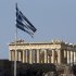 The Greek and European flags fly in front of the Parthenon of the Acropolis prior to a mass anti-government protest, in central Athens on Wednesday, Sept. 26, 2012. More than 50,000 people joined the union-led march during a general strike that ended in violence with clashes between riot police and hundreds of youths. The government in crisis-hit Greece is bracing for a new round of austerity measures despite being stuck in a four-year recession. (AP Photo/Dimitri Messinis)