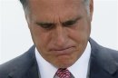 Romney pauses during his reaction to the Supreme Court's upholding of Obamacare in Washington