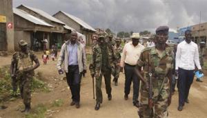 Congolese leaders of the M23 rebels are escorted in Bunagana in eastern DRC