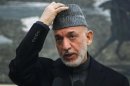 Afghan President Karzai speaks during a news conference in Kabul