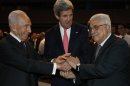 U.S. Secretary of State John Kerry, center, Israeli President Shimon Peres, right, and Palestinian President Mahmoud Abbas all shake hands during the World Economic Forum on the Middle East and North Africa at the King Hussein Convention Centre at the Dead Sea in Jordan Sunday May 26, 2013. (AP Photo/Pool, Jim Young)