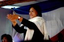 Wife of ex-president Marc Ravalomanana, Lalao, applauds during an electoral meeting on May 4, 2013 in Antananarivo