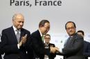 French President Francois Hollande (R) shakes hands with UN secretary general Ban Ki-moon next to French Foreign Minister Laurent Fabius (L) on December 12, 2015