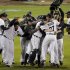 The Detroit Tigers celebrate after winning Game 4 of the American League championship series 8-1, against the New York Yankees, Thursday, Oct. 18, 2012, in Detroit. The Tigers move on to the World Series. (AP Photo/Charlie Riedel)