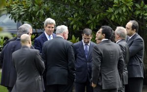 U.S. Secretary of State John Kerry, center left, talks …