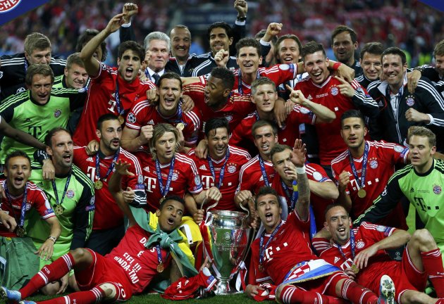 The Bayern Munich squad pose with the trophy after defeating Borussia Dortmund in their Champions League Final soccer match at Wembley Stadium in London