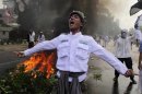 Indonesian Muslim protester shouts slogans during a protest in Jakarta
