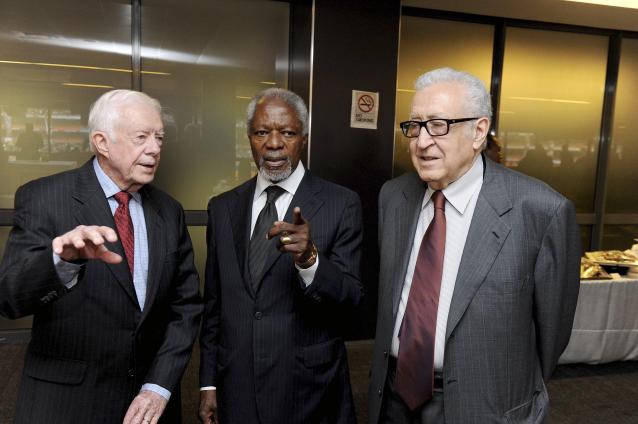 Handout of Carter, Annan and Moussa speaking at the memorial service for Mandela in Johannesburg