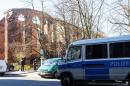 Police cars stand in front of the ruins of the Franciscan Monastery in Berlin on April 5, 2015, where the body of Israeli Yosi Damari was found