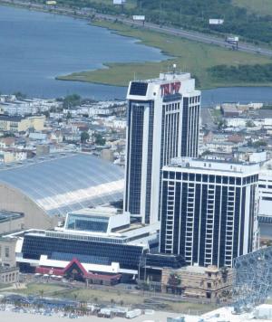 Trump Plaza Hotel and Casino in Atlantic City N.J., shown here on July 11, 2014, will shut down on Sept. 16, its parent company told The Associated Press on Saturday July 12, 2014. It would be the third Atlantic City casino to shut down this year, and more than 1,000 workers would lose their jobs. (AP Photo/Wayne Parry)