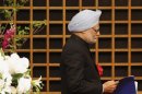 Indian Prime Minister Manmohan Singh walks towards podium to deliver his speech in Tokyo