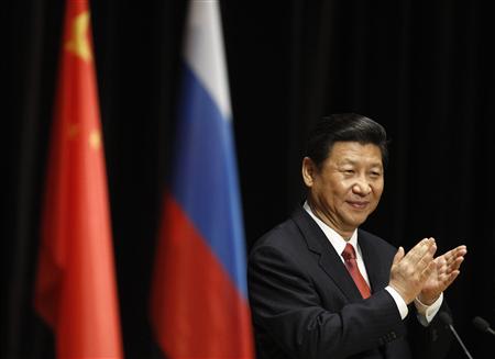 Chinese President Xi Jinping claps during his address to students at the Moscow State Institute of International Relations in Moscow March 23, 2013. REUTERS/Sergei Karpukhin
