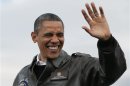 U.S. President Barack Obama waves at a campaign event at Austin Straubel Airport International Airport in Wisconsin