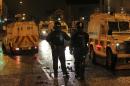 Police in armoured vehicles secure the area in Carrickfergus, near Belfast in County Antrim, Northern Ireland on January 11, 2013