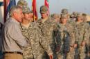 U.S. Secretary of Defense Chuck Hagel greets U.S. troops upon his arrival at Camp Buehring, Kuwait, Monday, Dec. 8, 2014. Hagel visited the camp which once was a staging post for troops headed to Iraq. (AP Photo/Mark Wilson, Pool)