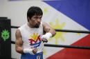 Boxer Manny Pacquiao, of the Philippines, shadow-boxes during his workout, Monday, April 13, 2015, in Los Angeles. Pacquiao will face Floyd Mayweather Jr. in a welterweight boxing match in Las Vegas on May 2. (AP Photo/Jae C. Hong)