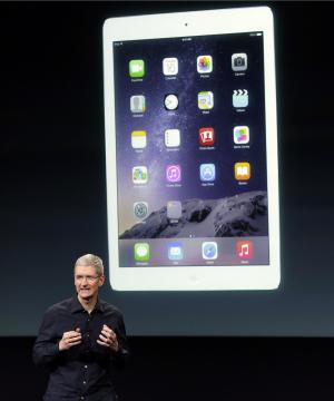 Apple CEO Tim Cook introduces the new Apple iPad Air 2 during an event at Apple headquarters on Thursday, Oct. 16, 2014 in Cupertino, Calif. (AP Photo/Marcio Jose Sanchez)