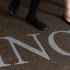 Office workers walk out of ING Tower in Hong Kong