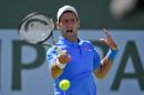 Novak Djokovic, of Serbia, returns to Andy Murray, of Great Britain, during their semifinal match at the BNP Paribas Open tennis tournament, Saturday, March 21, 2015, in Indian Wells, Calif. (AP Photo/Mark J. Terrill)