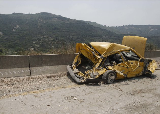 The wreckage of a car is seen in Haffeh