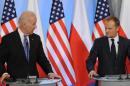 U.S. Vice President Joe Biden, left, and Polish Prime Minister Donald Tusk look at each others during a press conference after talks in Warsaw, Poland, Tuesday, March 18, 2014. Biden arrived in Warsaw for consultations with Prime Minister Donald Tusk and President Bronislaw Komorowski, a few hours after Russian President Vladimir Putin approved a draft bill for the annexation of Crimea, one of a flurry of steps to formally take over the Black Sea peninsula. (AP Photo/Alik Keplicz)