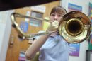 Fifth-grader born without hands plays trombone in honors band